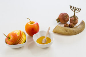 A shot of symbols of the Jewish new year on white background